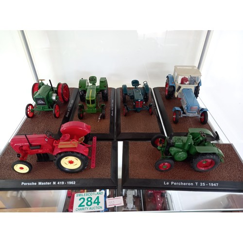 284 - Collection of 21 Atlas Edition model tractors, with certificates