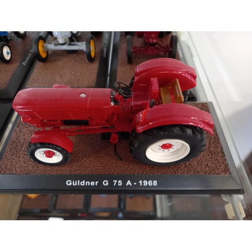 284 - Collection of 21 Atlas Edition model tractors, with certificates