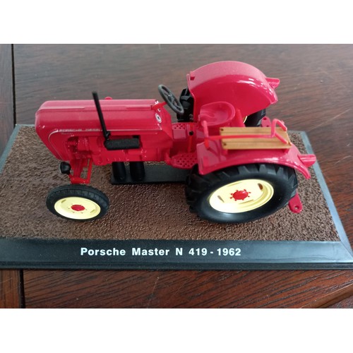 284 - Collection of 21 Atlas Edition model tractors, with certificates