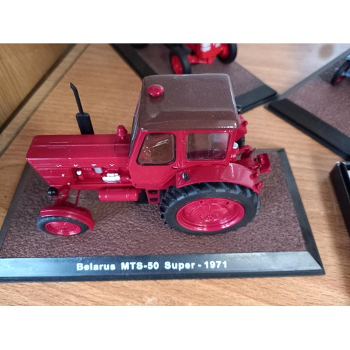 284 - Collection of 21 Atlas Edition model tractors, with certificates