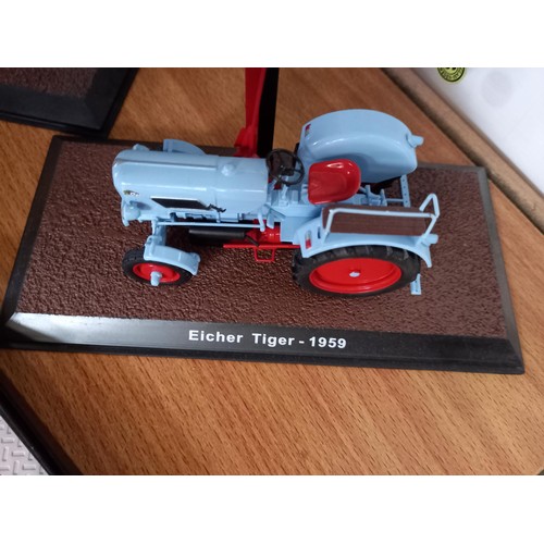 284 - Collection of 21 Atlas Edition model tractors, with certificates