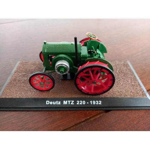 284 - Collection of 21 Atlas Edition model tractors, with certificates