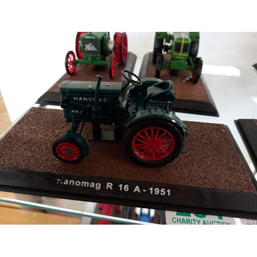 284 - Collection of 21 Atlas Edition model tractors, with certificates