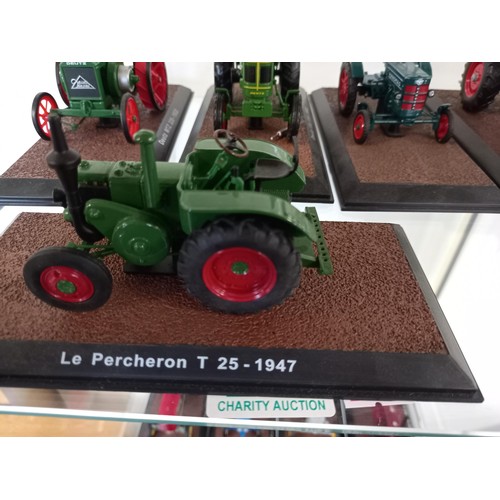 284 - Collection of 21 Atlas Edition model tractors, with certificates