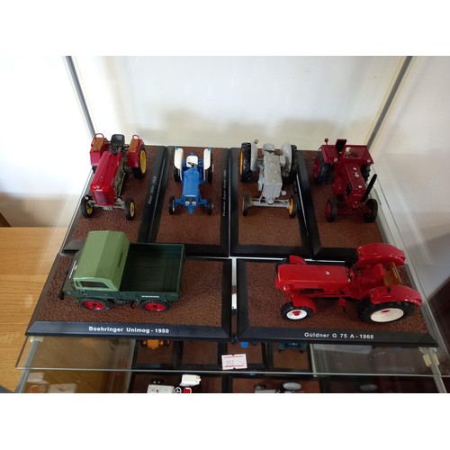 284 - Collection of 21 Atlas Edition model tractors, with certificates