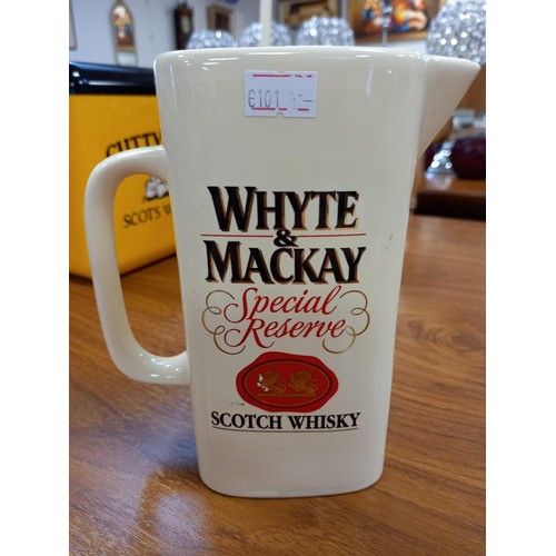 321 - Bowmore and Whyte and MacKay whisky jugs plus Cutty Sark ice bucket