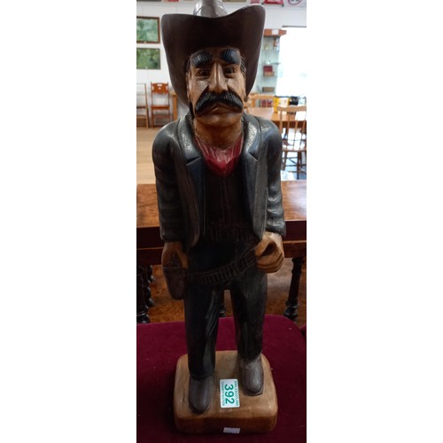 392 - wooden cowboy statue