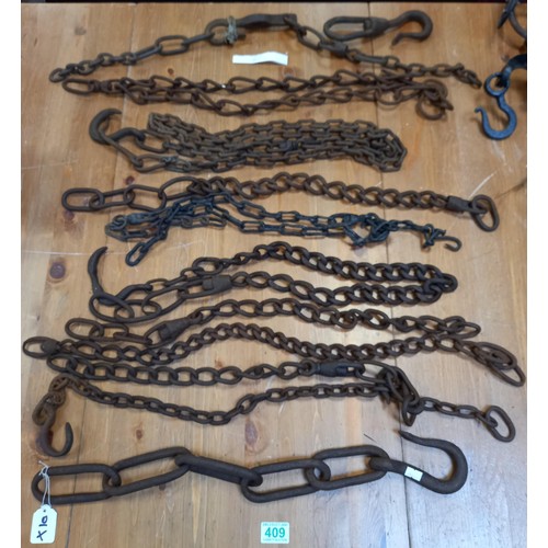 409 - Selection of vintage chains for farm/iron work