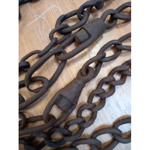 409 - Selection of vintage chains for farm/iron work