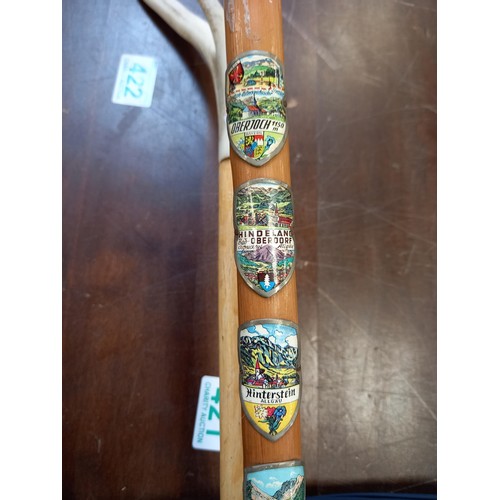 422 - Horn handled walking stick and wooden walking stick with badges