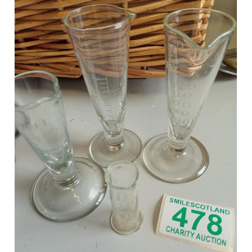 478 - Three vintage glass measures and one other.