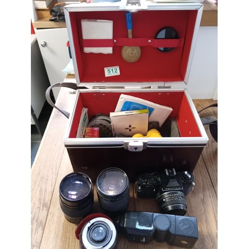 512 - A selection of camera lenses made in japan and a Pentax camera etc etc all direct from an abandon st... 