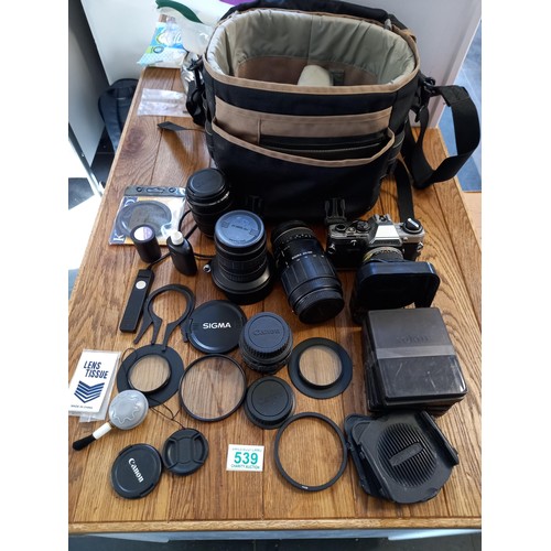 539 - Olympus om10 camera plus bag , coloured filters and 4 different lenses see photos