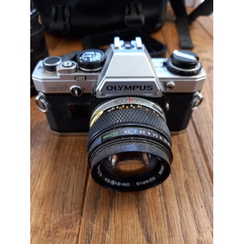 539 - Olympus om10 camera plus bag , coloured filters and 4 different lenses see photos