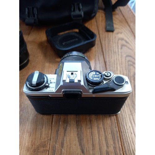 539 - Olympus om10 camera plus bag , coloured filters and 4 different lenses see photos