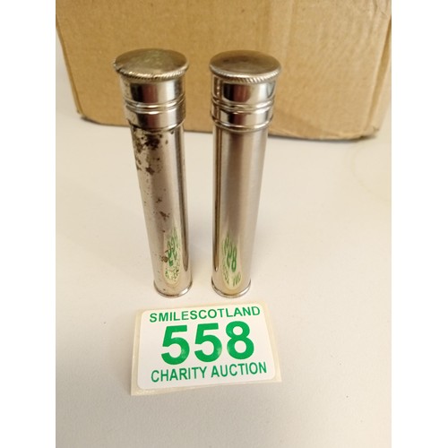 558 - 2x glass medicine bottles in metal cases