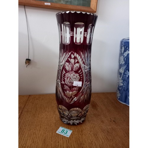 83 - Clear and cranberry glass vase  30 cm high