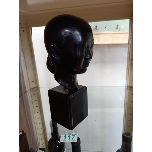 117 - Oriental ladies head, believed bronze, with signature on wooden base