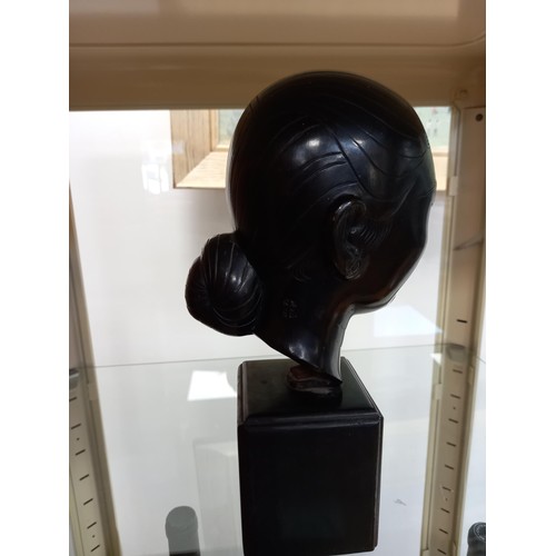 117 - Oriental ladies head, believed bronze, with signature on wooden base