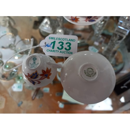 133 - Pair of miniature cups and saucers