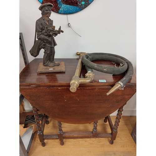 216 - table , brass pump hose and a cast golfer