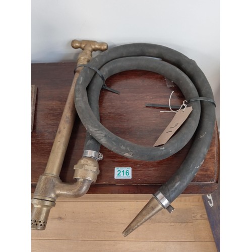 216 - table , brass pump hose and a cast golfer