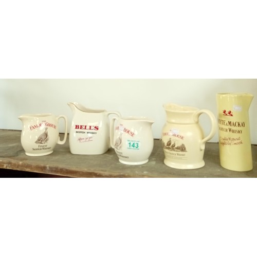 143 - Selection of whisky jugs