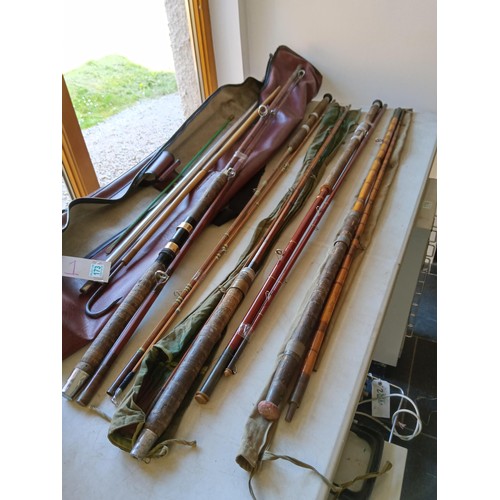 173 - Selection of vintage fishing rods and gaff