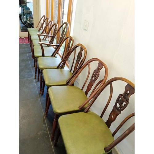 389 - one carver and eight other dining table chairs with rose and lion carved shields