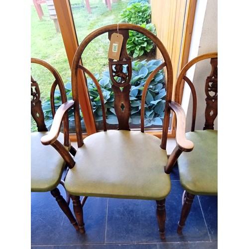 389 - one carver and eight other dining table chairs with rose and lion carved shields