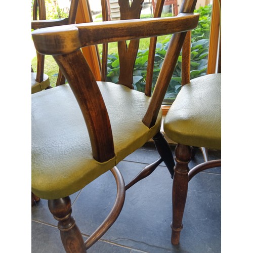 389 - one carver and eight other dining table chairs with rose and lion carved shields