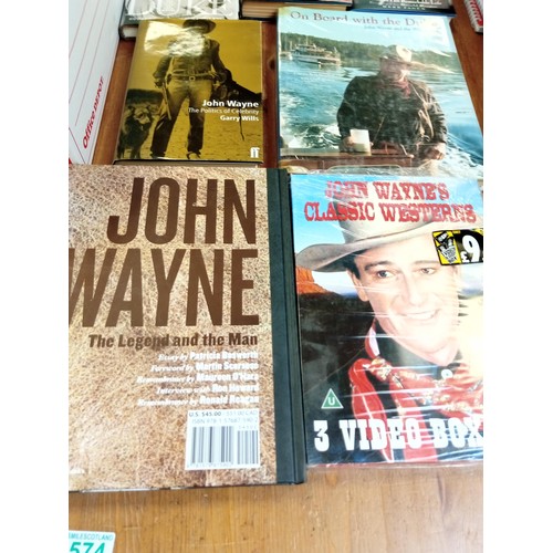 574 - A good selection of John Wayne books etc