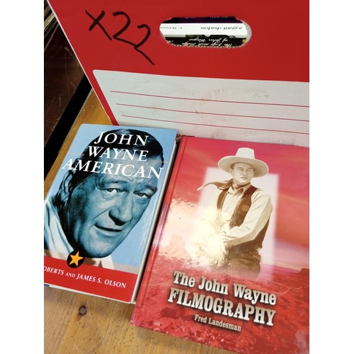 574 - A good selection of John Wayne books etc