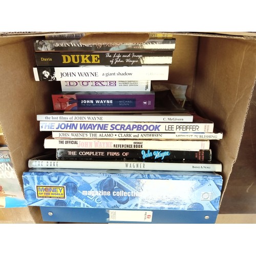 574 - A good selection of John Wayne books etc