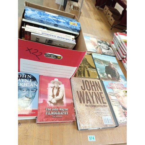 574 - A good selection of John Wayne books etc