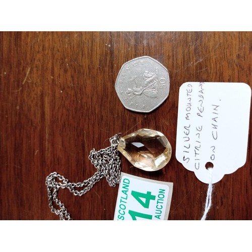 414 - Silver mounted Citrine pendant on chain 50p for size only