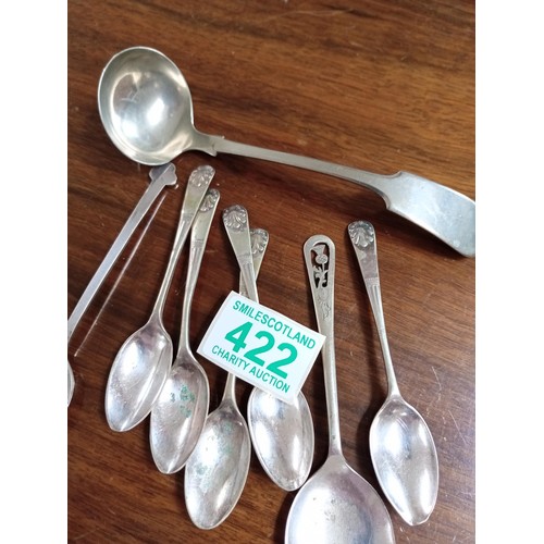 422 - Collection of white metal teaspoons and a toddy spoon