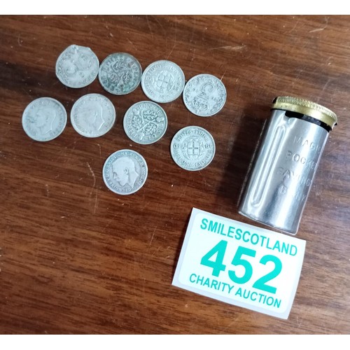 452 - Vintage magic pocket saving tube with over 30 silver three pence pieces