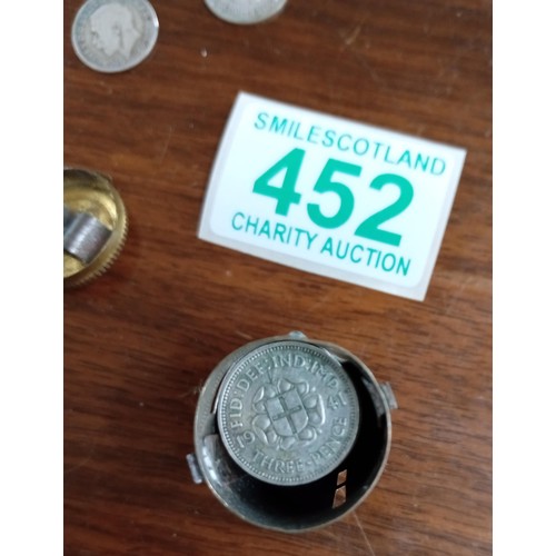 452 - Vintage magic pocket saving tube with over 30 silver three pence pieces