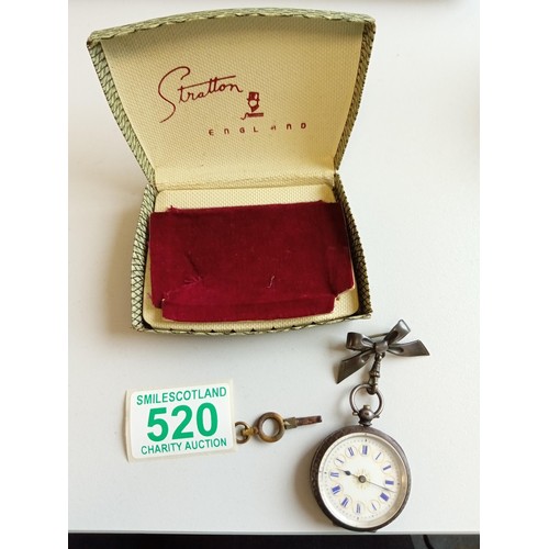 520 - Silver Edwardian ladies watch with bow which is silver hallmarked watch does tick but no guarantee