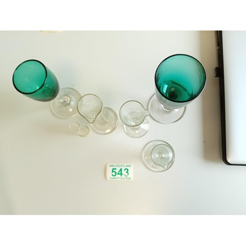 543 - Three vintage glass measures and one other plus 2 vintage Victorian green glasses