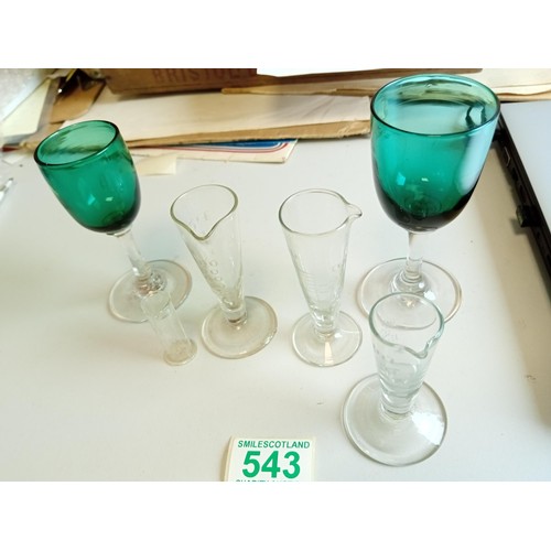 543 - Three vintage glass measures and one other plus 2 vintage Victorian green glasses