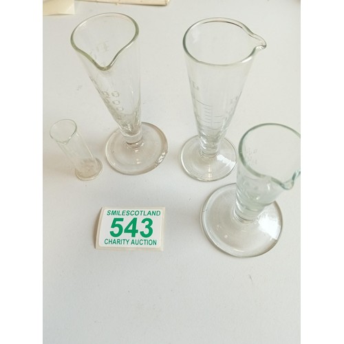 543 - Three vintage glass measures and one other plus 2 vintage Victorian green glasses