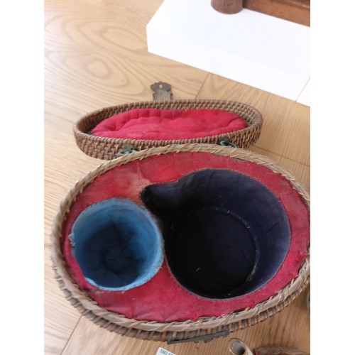 33 - oriental teapot in basket with cup and one other