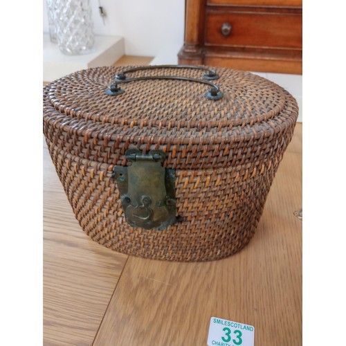 33 - oriental teapot in basket with cup and one other