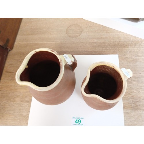 49 - 2 x clay jugs with glazed interiors