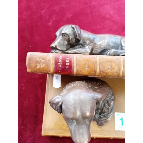 136 - 2 x ornamental dogs on books figurines