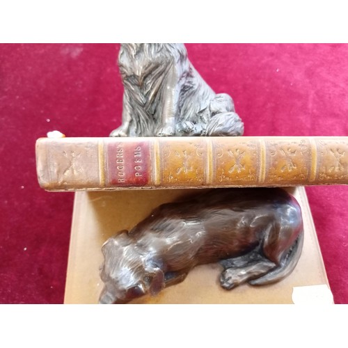 136 - 2 x ornamental dogs on books figurines