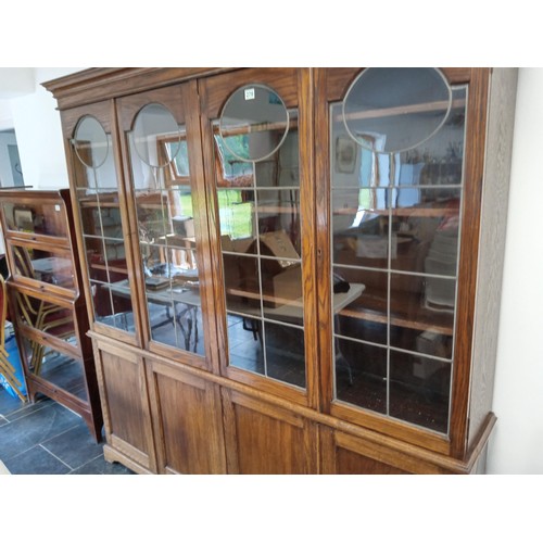 278 - large bookcase with 4 door cupboards and leaded glass