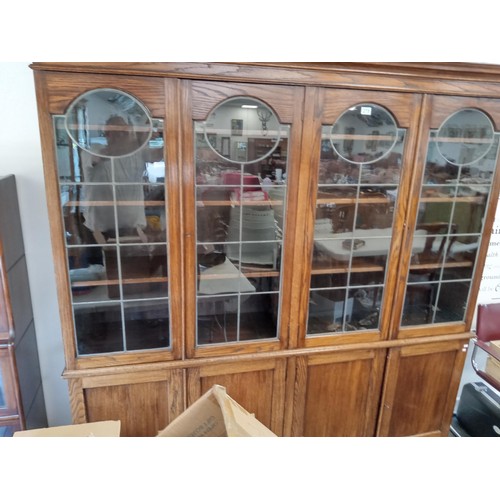 278 - large bookcase with 4 door cupboards and leaded glass